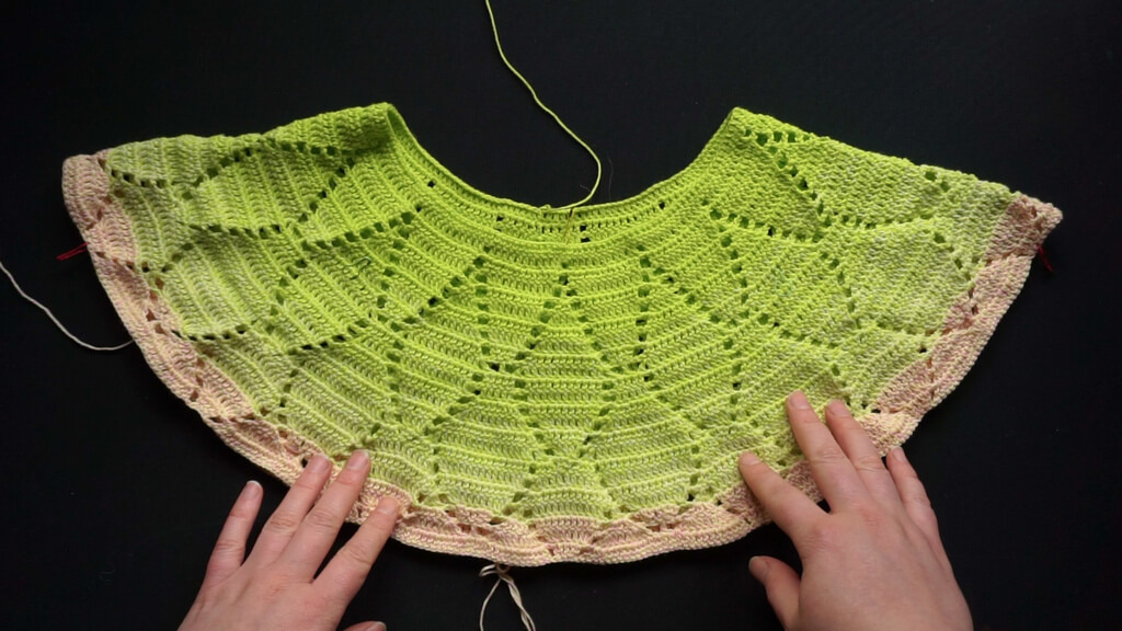 Lifting the back neckline of crochet round yokes 10 Folded yoke with the bottom edge aligned, showing the difference between the front of the yoke neckline and the back, which is higher by about 2.5 cm or 1".