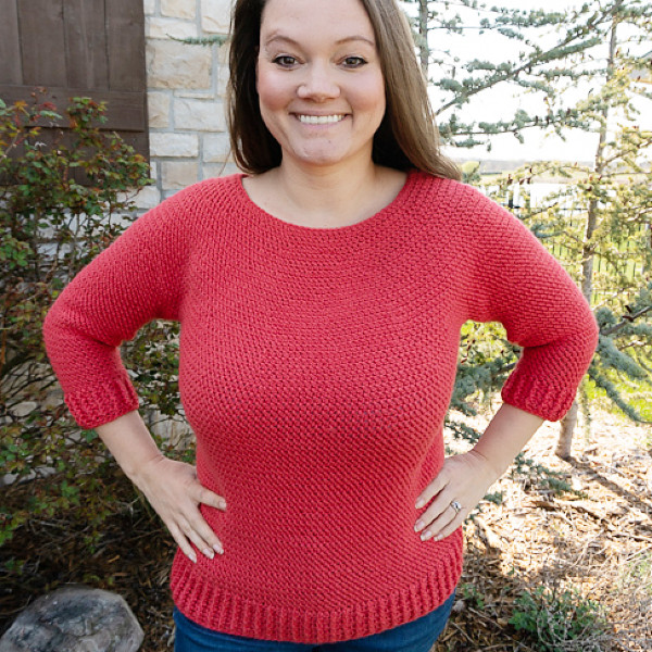 10+ Crochet round yoke sweaters and tops 10 Simple round yoke sweater in coral pink yarn, with 3/4 sleeves and ribbing on the bottom and sleeve edges.
