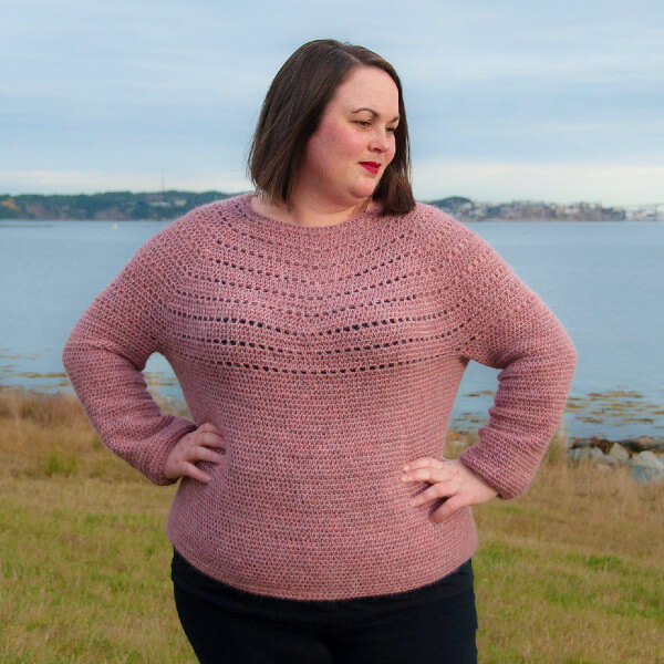 10+ Crochet round yoke sweaters and tops 5 Dusty pink and fluffy sweater with round yoke construction and long sleeves. The yoke features parallel bands of eyelets.