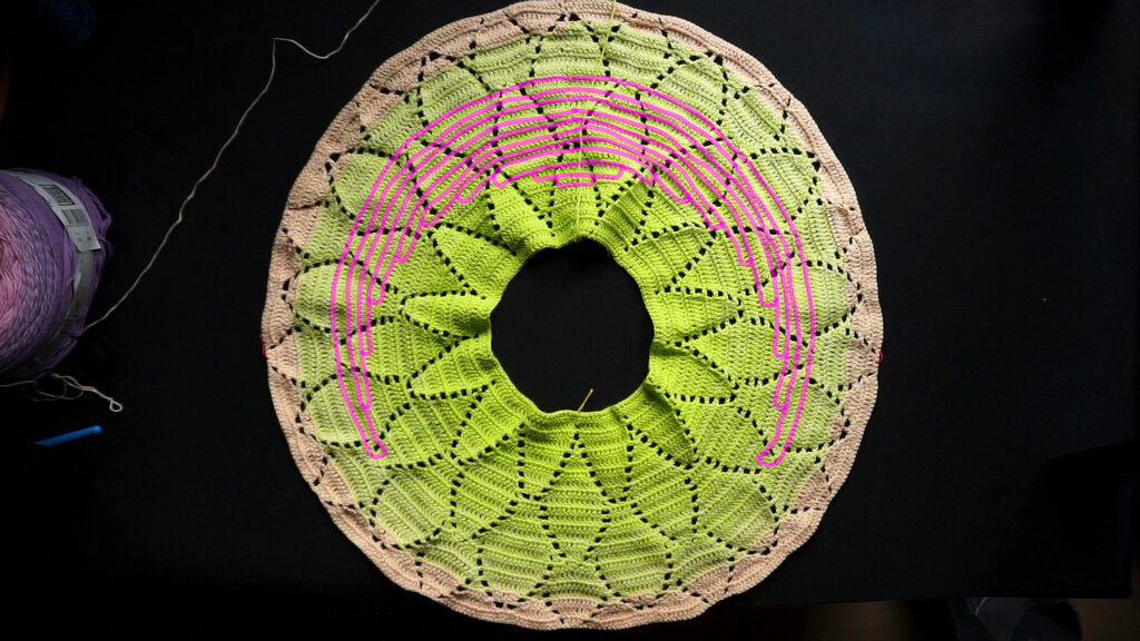 Lifting the back neckline of crochet round yokes 9 Full round yoke with an overlay of sketched sections at the back of the yoke, becoming progressively longer towards the edge of the yoke, symbolizing the length of the sections with tall stitches.