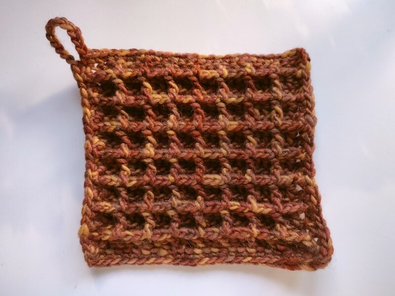 Waffle stitch potholder made in brown variegated chunky wool yarn