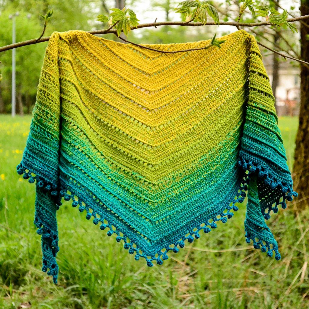 Gooseberry marmalade shawl on a branch, showing the beautiful curling of the sides