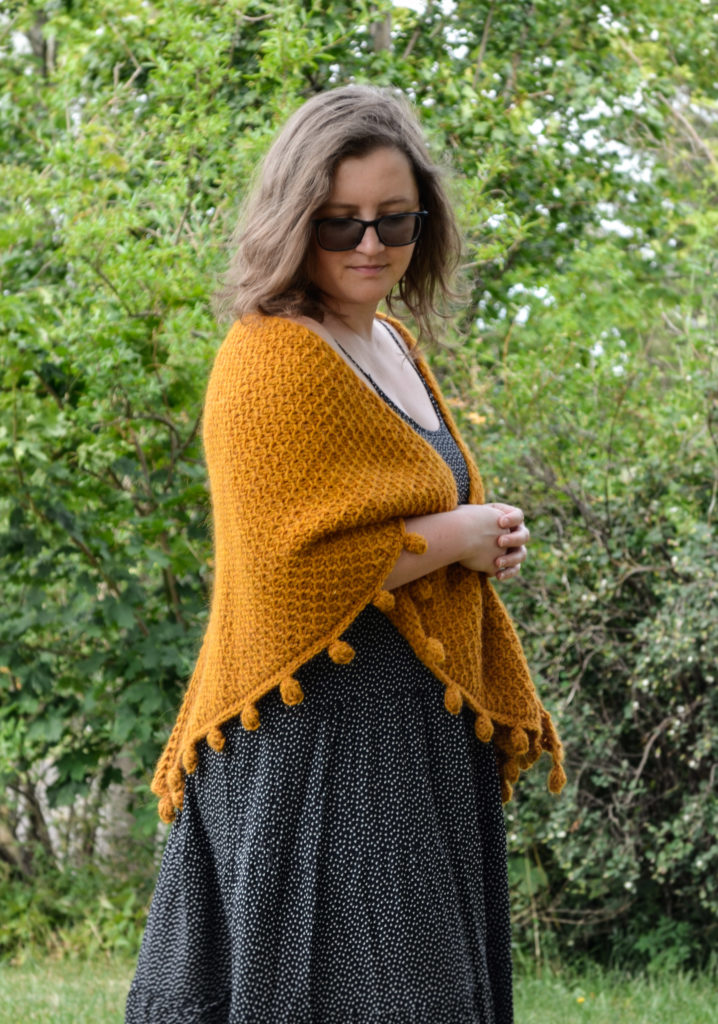 One way of wearing a Tunisian crochet shawl - around the shoulders