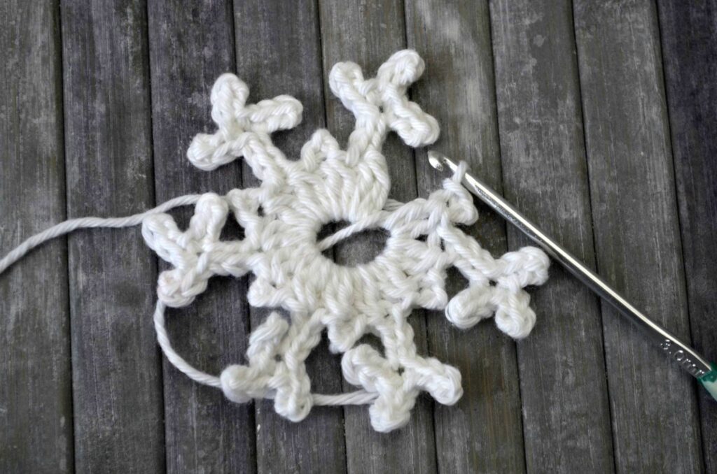 Easy snowflake crochet pattern yarnandy step 18