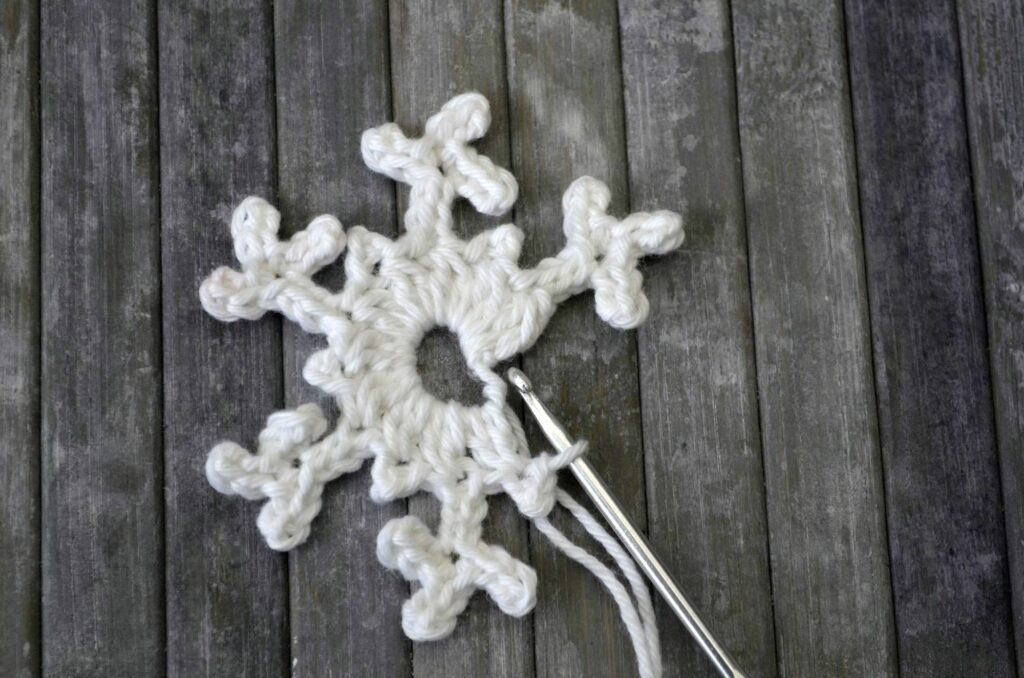 Easy snowflake crochet pattern yarnandy step 17
