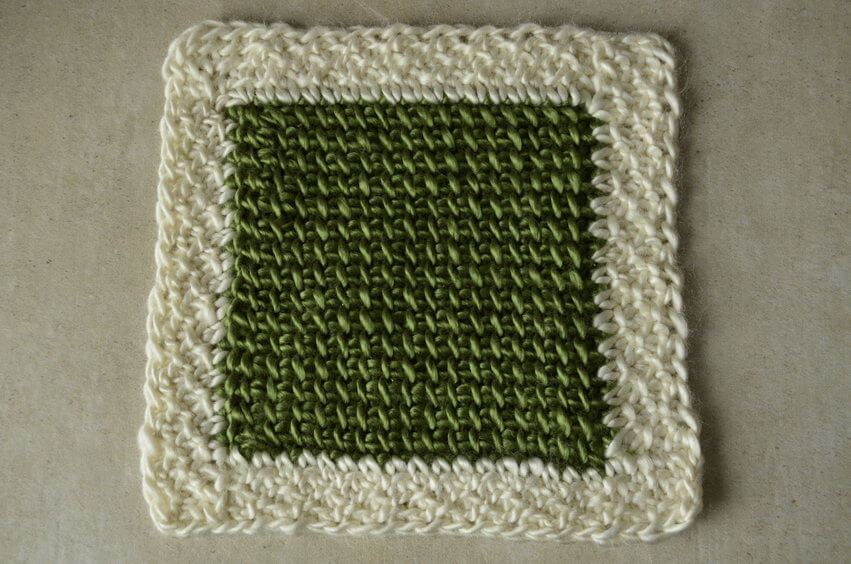 Reduce or remove Tunisian crochet curling by adding a non-curling border after the project is finished