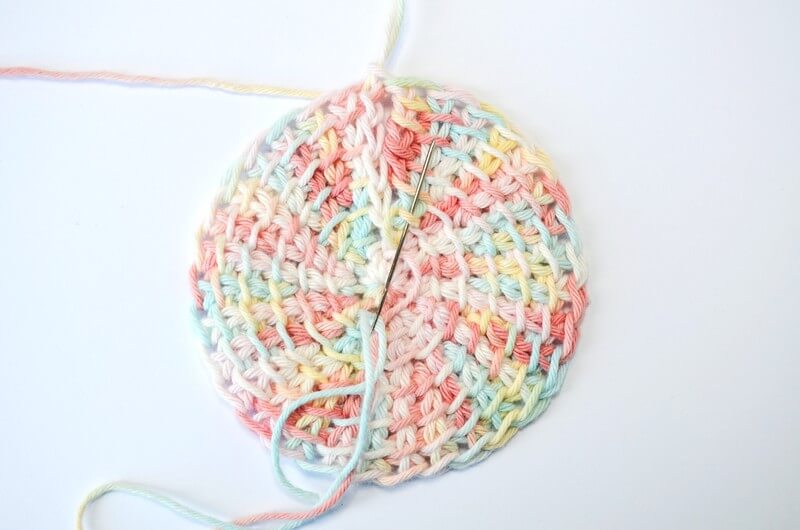 Tunisian crochet face scrubbies starting the seam