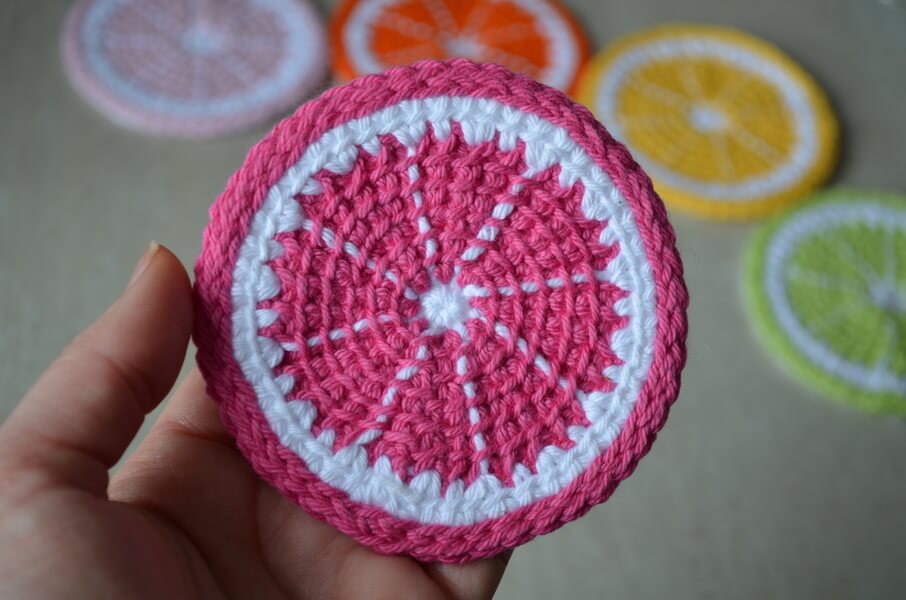 Citrus slice - Tunisian crochet coasters - hot pink grapefruit slice