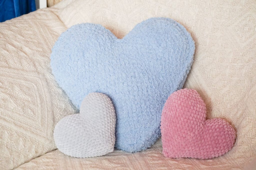 tunisian crochet heart pillow with small amigurumi heart pillows