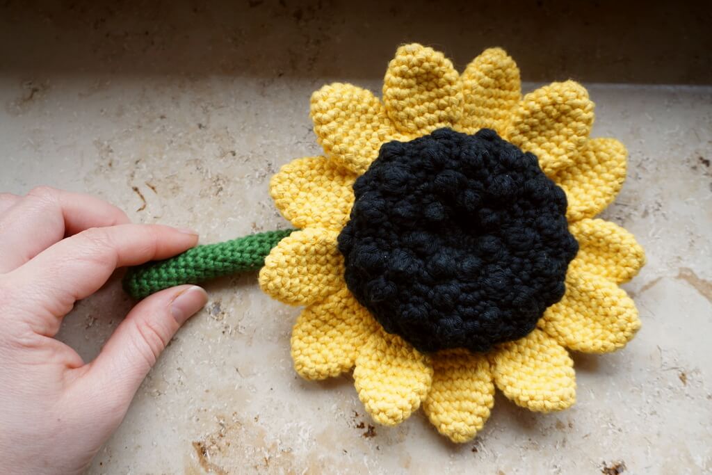 Cotton version of the amigurumi sunflower with a black center