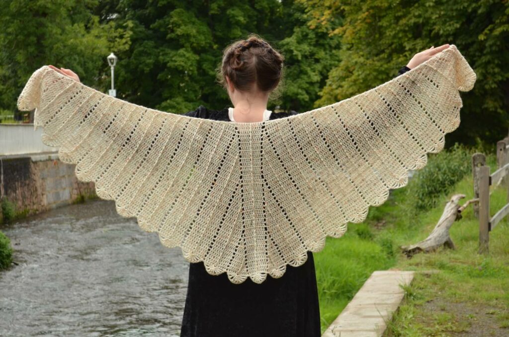 Lark wings shawl shown in full, with the feathers growing from the top and the middle feather.