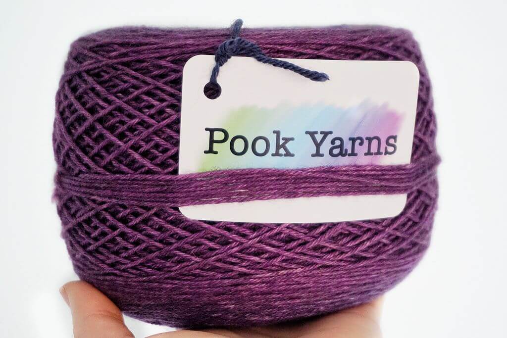 Pook Yarns DK Yak silk merino cake with logo