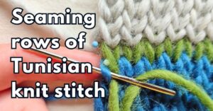 Close-up of loose grafted seam in green yarn made between blue and light gray fabrics in Tunisian knit stitches, with text "Seaming rows of Tunisian knit stitches"