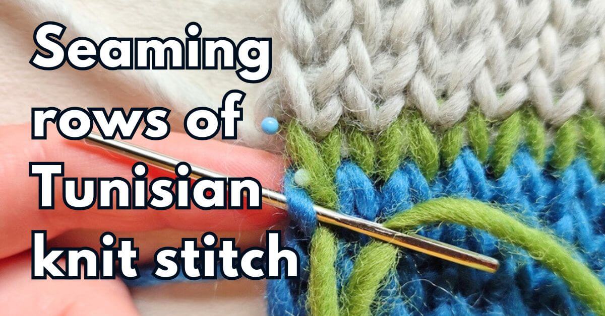 Close-up of loose grafted seam in green yarn made between blue and light gray fabrics in Tunisian knit stitches, with text "Seaming rows of Tunisian knit stitches"
